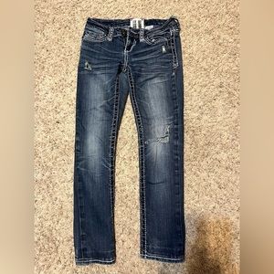 Trademark distressed skinny jeans